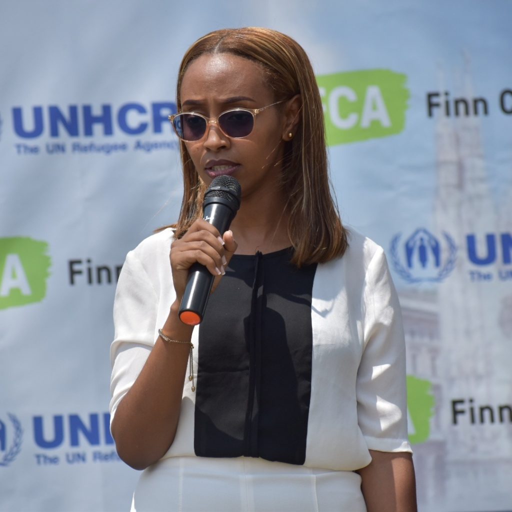 A woman speaking into a microphone