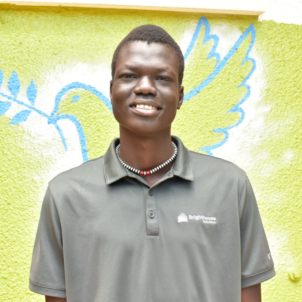 Am man standing infront of a wall