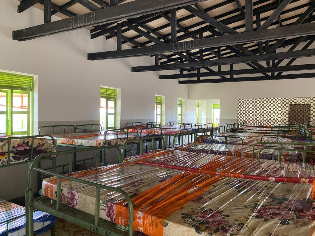 An inside of a building with mattresses on beds