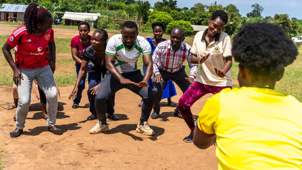 A group of females and males dancing